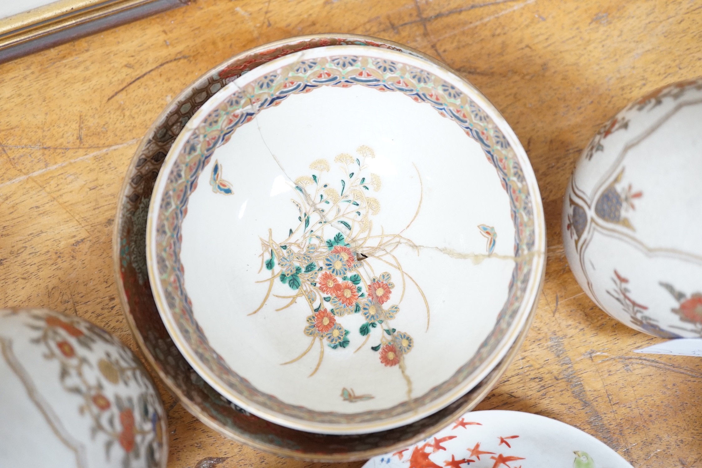 A group of Japanese Satsuma pottery, other ceramics, wood stands etc, a pair of vases 18cms high